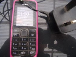 Nokia mobile phone and charger. 