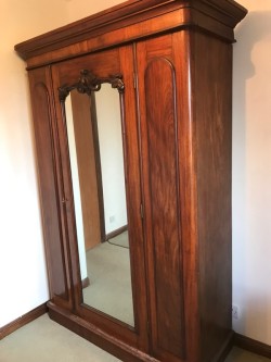 Antique Wooden Wardrobe with a mirrored door 