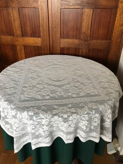 Circular Green tablecloth with white lace overlay 