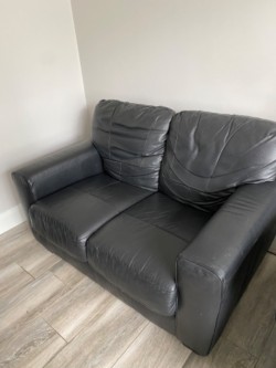 Black leather 2 seater sofa 
