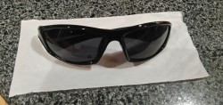 BLACK SUNGLASSES WITH WHITE STRIP ON SIDES (BRAND NEW). 