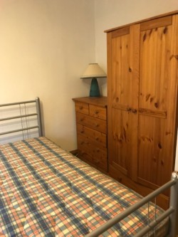 Bed, mattress, wardrobe, chest of drawers, locker and two lamps 