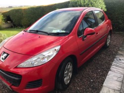 Red Peugeot 207 2010 